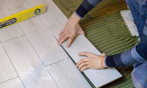 lay tiles on the floor in the house selective focu 9UJ2VTY lay tiles on the floor in the house selective focu 9UJ2VTY